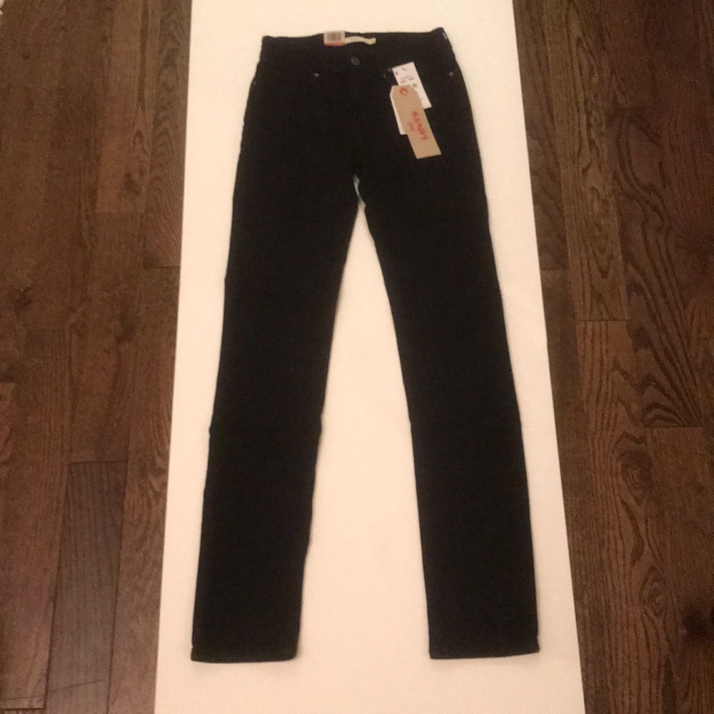 Levi’s black mid rise skinny jeans
